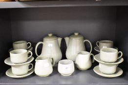 A mid century Prinknash part tea service in a mottle green glaze.