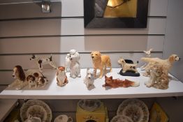A collection of animal themed figure studies including a Wedgwood deer, Sylvac spaniel and puppies