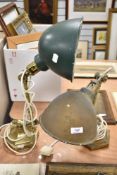 A pair of unmatched Edwardian desk top mounted library lights, with adjustable brass arms.