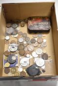 A selection of collectable coins and currency including commemorative coins.