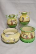 Four pieces of early 20th century Royal Doulton in the Dutch Harlem pattern two planters and a