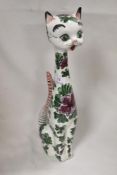 A mid century ceramic figure of a cat decorated in a kitsch design stamped Italy to base 38cm tall