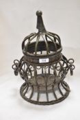 A modern bird cage style ornament with detachable lid