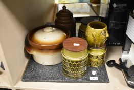 Three mid century Hornsea Pottery kitchen storage jars with two granite chopping boards.