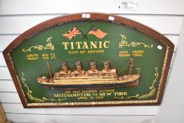 A modern reproduction wall plaque commemorating the Titanic