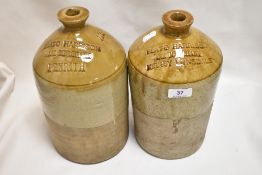Two early 20th century salt glazed flagons for Plato Harrison, one for Kirkby Lonsdale and one for