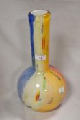 A modern art glass vase of bottle form possibly by Murano having five colour base with rod work