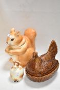 Three novelty kitchen jars including Portmeirion egg nest, Goebels cow jar and a Squirrel form jar