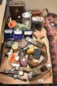 An Assorted selection of items including cigarette lighters, cuff links, leather cases and