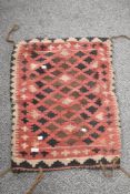 A 20th century Persian Afghan Balouch saddle bag in woven wool in a cream and red ground 80cm x