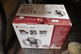 A modern Picture Mate 500 personal photo printer.