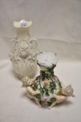 A late Victorian Sitzendorf porcelain vase decorated with two cherubs and rose bush, One cherub