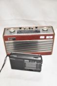 A mid century Roberts radio with wooden and vinyl case with a modern Grundig radio.