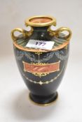 A fine early 20th century mantel urn possibly Derby porcelain, hand decorated by William Larcombe