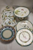 Two 18th century French delft plates with a matching tazza, and a porcelain possibly Mintons tazza