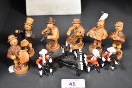 A miniature wooden hand made band of six figures with art glass classical trio made from lamp work