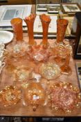 A collection of Victorian Carnival glass including two matching vase sets, bowls and Peacock