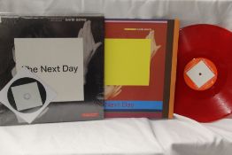 A NM/NM copy of David Bowie album 'Next Day' incredibly hard to find 'Paul Smith' red vinyl Polish