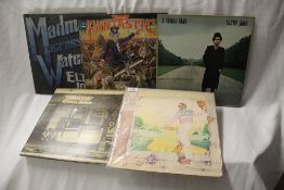 A lot of four Elton John albums