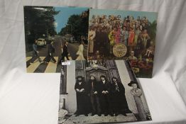 A lot of three Beatles albums including a rare Spanish export pressing