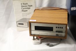 A stand alone 8-Track player by BRS McDonald with two boxes of 8 tracks. A great retro talking