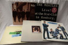 A lot of five Beatles compilations