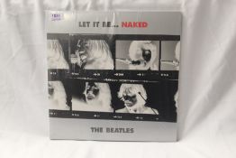 A scarce NM/NM press of 'Let it be Naked' original vinyl, a sought after album which you won't see a