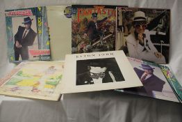 A lot of Elton John albums with a tour programme