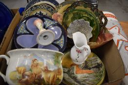 A box with collectors plates, blue and white etc