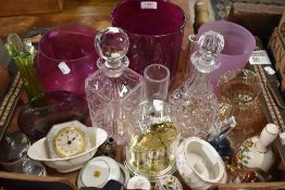 Two heavy cut glass decanters, three purple glass vases and an orchid pot, an anniversary clock with