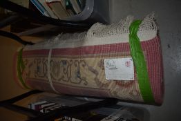 A Chineses style G H Prith Ltd Traditional rug in pink, beige and blue tones.