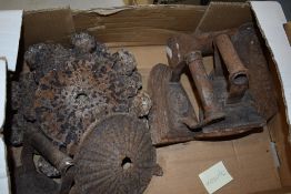 Two vintage cast iron spittoon lids, three flat irons and a show last.