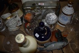 Four ceramic whiskey containers including Famous Grouse, Bells and Kings Ransom as well as a Toby