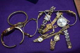 10 wrist watches all in gold tones.