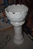 A white ceramic plant stand and bowl with embossed daisy design. 27cm approx.