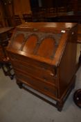 An early to mid 20th Century oak bureau
