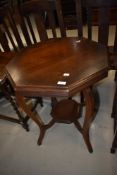 An early 20th Century mahogany occasional table having octagonal top and undertier on shaped legs