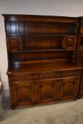 A reproduction oak dresser, probably Titchmarsh and Goodwin