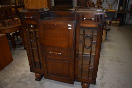 An early 20th Century oak side by side bureau display , having Art Deco handles