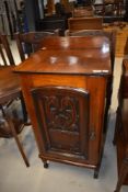 A 19th Century and later pot cupboard having carved vase to door panel