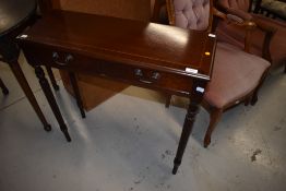 A reproduction mahogany side table