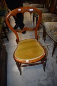 A Victorian mahogany bedroom chair having later dralon seat