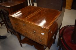 A Georgian vanity wash stand having fold out top with three drawers and two false fronted drawers on