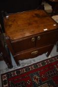A Georgian mahogany cabinet, possibly converted step commode with two door cabinet over pull out