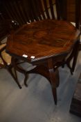 An Edwardian rosewood occasional table having line inlay decoration with octagonal top and shaped