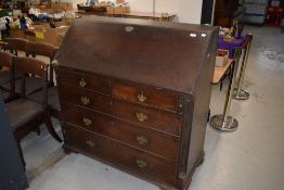 A Georgian mahogany burea having fitted interior, drop flap over two over three drawers, width
