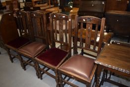 A set of four early 20th Century oak dining chairs