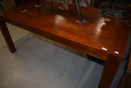 A modern stained frame dining table, approx 180 x 90cm