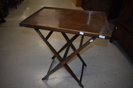 An early 20th Century oak folding table, labelled to base, Stone's Patent Cavendish Table