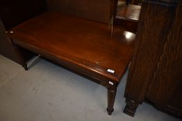 A reproduction mahogany coffee table in the classical style, width approx. 108cm